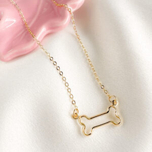 Colar pingente de ossinho vazado liso folheado a ouro